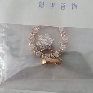 Gold and diamond charm (not real)